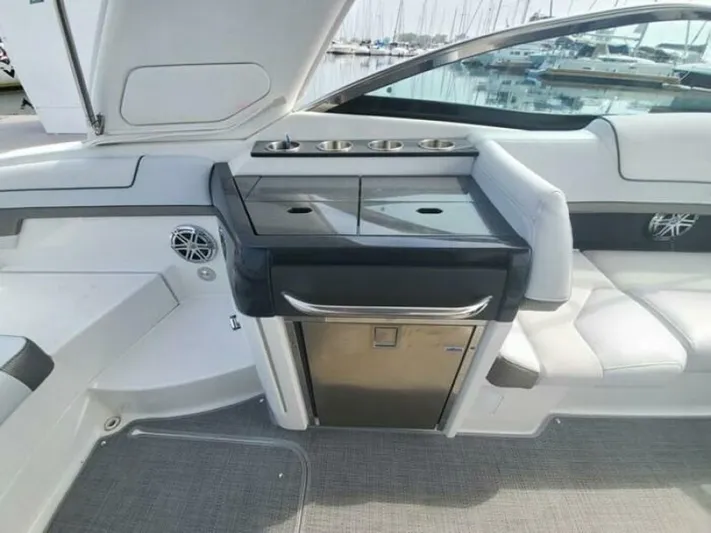  Yacht Photos Pics 2017 Formula 310SS boat interior with seating and built-in kitchenette.