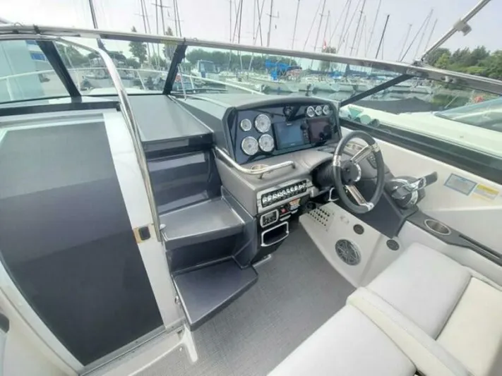  Yacht Photos Pics 2017 Formula 310SS boat cockpit with modern dashboard and steering wheel.