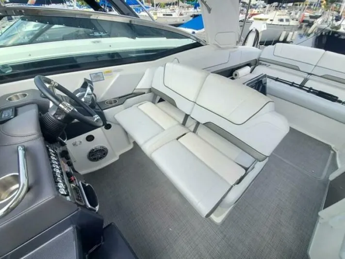  Yacht Photos Pics 2017 Formula 310SS boat interior with white seating and modern dashboard.