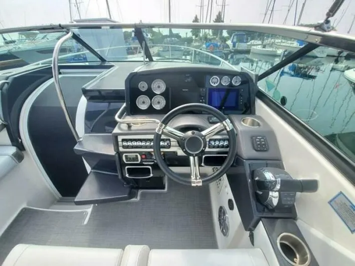  Yacht Photos Pics 2017 Formula 310SS boat cockpit with steering wheel and control panel.