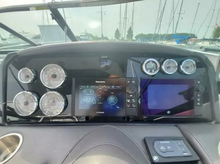  Yacht Photos Pics Dashboard of a 2017 Formula 310SS boat with gauges and navigation screens.