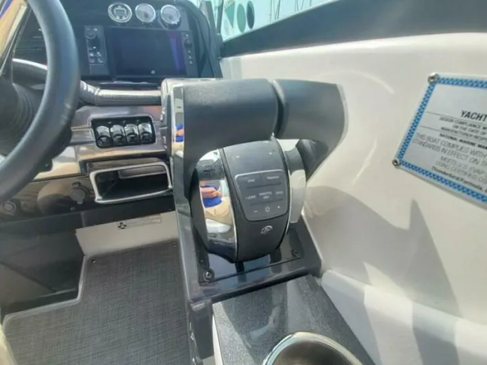  Yacht Photos Pics 2017 Formula 310SS boat cockpit with control panel and throttle lever.