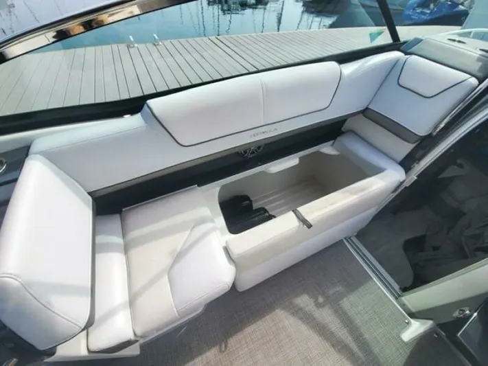  Yacht Photos Pics 2017 Formula 310SS boat interior with white seating and storage compartment.