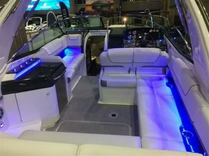  Yacht Photos Pics 2017 Formula 310SS boat interior with blue LED lighting and luxurious seating.