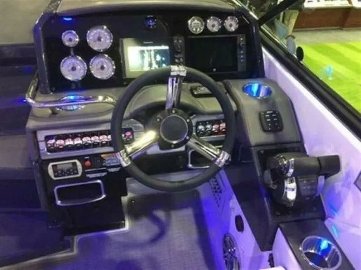  Yacht Photos Pics 2017 Formula 310SS boat dashboard with steering wheel and control panel.