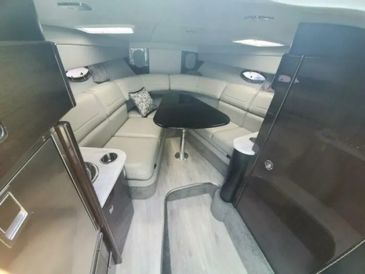  Yacht Photos Pics Luxurious interior of a 2017 Formula 310SS boat with elegant seating and modern design.