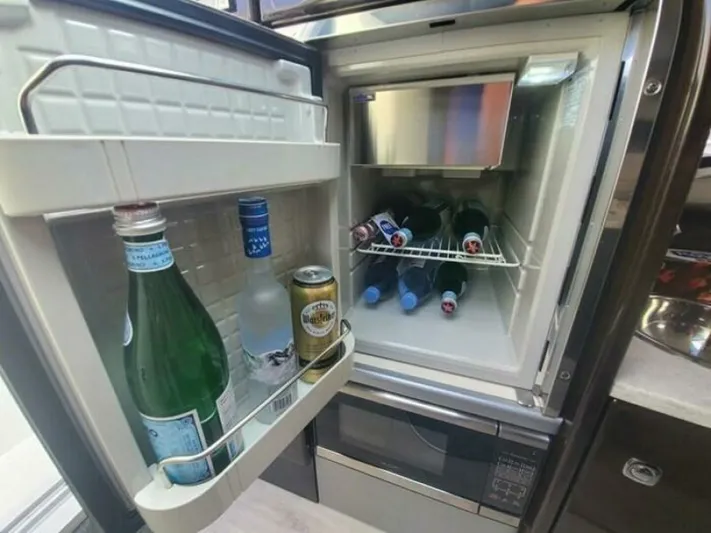  Yacht Photos Pics Mini fridge stocked with beverages inside a 2017 Formula 310SS boat.