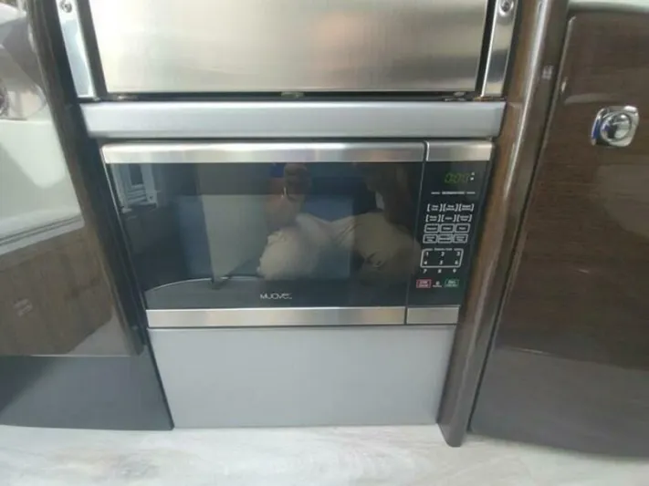  Yacht Photos Pics Built-in microwave in a 2017 Formula 310SS boat kitchen area.