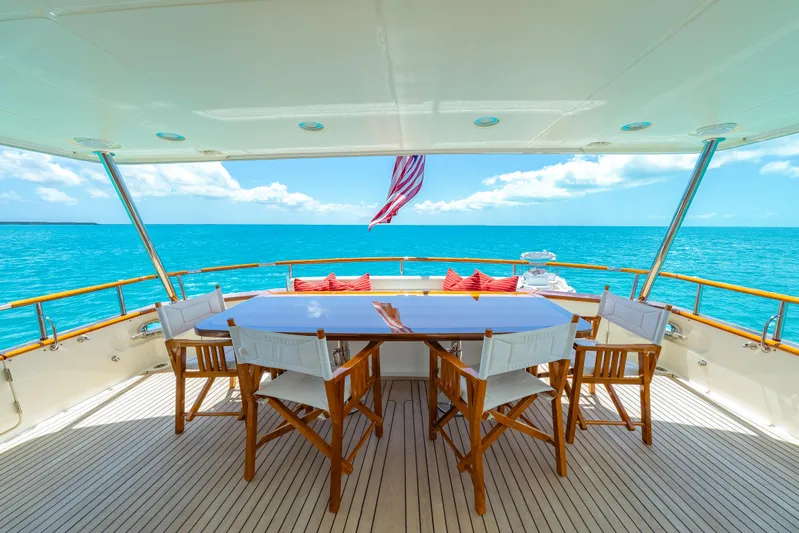 Beth Ann Yacht Photos Pics Luxurious Marlow 80E yacht deck with ocean view, featuring elegant dining setup, 2017 model.