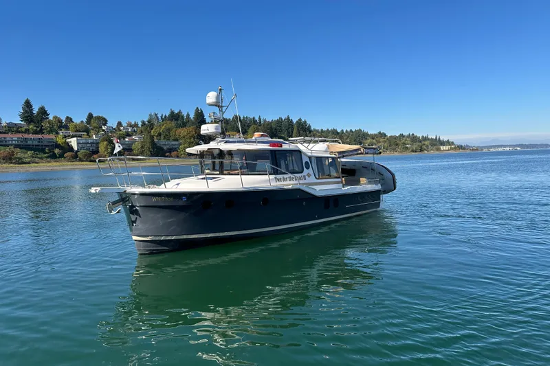 Two For The Road II Yacht Photos Pics 2020 Ranger Tugs R-29 boat on calm water with scenic shoreline background.