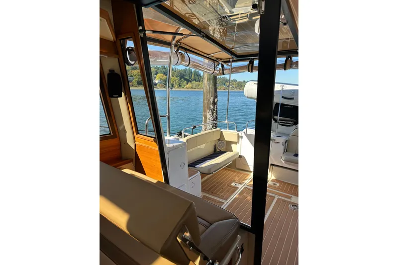 Two For The Road II Yacht Photos Pics Interior view of 2020 Ranger Tugs R-29 boat with scenic water backdrop.