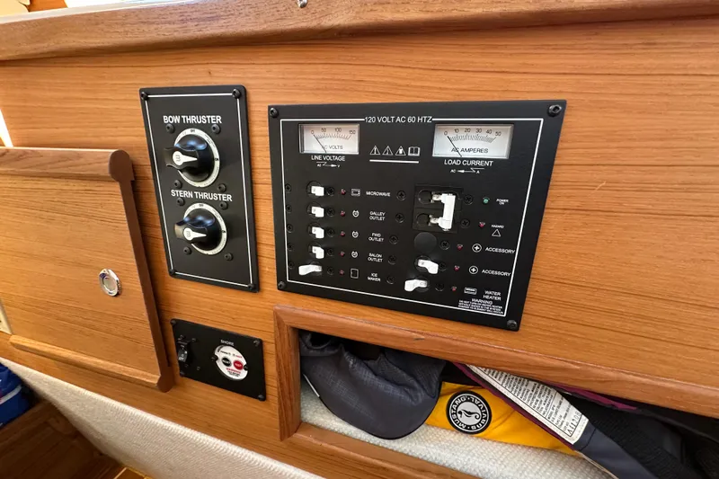 Two For The Road II Yacht Photos Pics Control panel of a 2020 Ranger Tugs R-29 boat, featuring thruster and electrical controls.