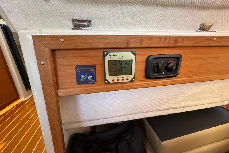 Two For The Road II Yacht Photos Pics Control panel inside 2020 Ranger Tugs R-29 boat, featuring digital displays and wooden trim.