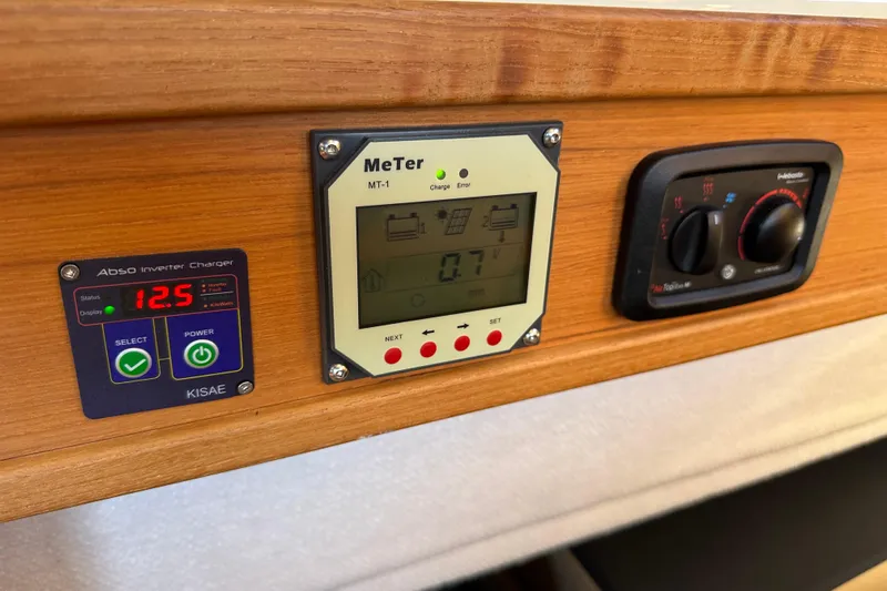 Two For The Road II Yacht Photos Pics Control panel on 2020 Ranger Tugs R-29 with inverter charger and meter display.