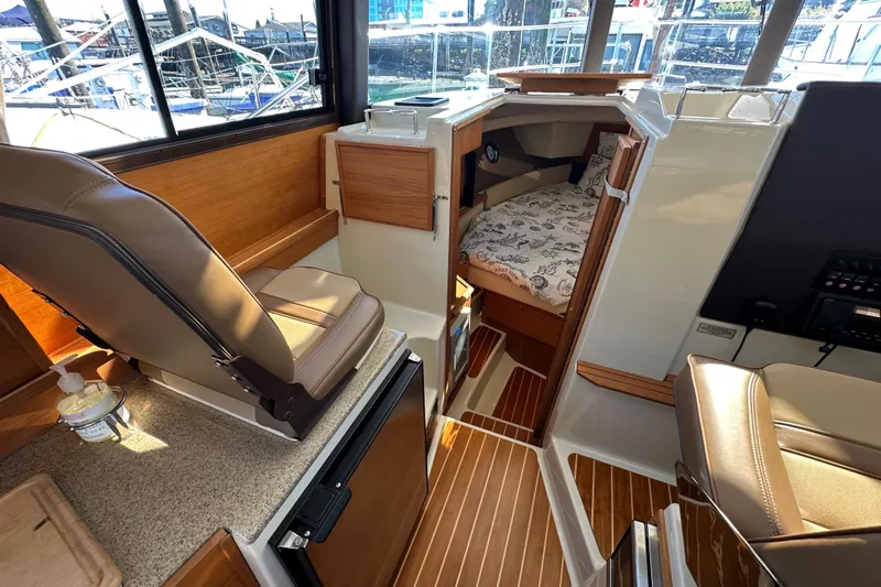 Two For The Road II Yacht Photos Pics Interior of 2020 Ranger Tugs R-29 boat with seating and cabin view.
