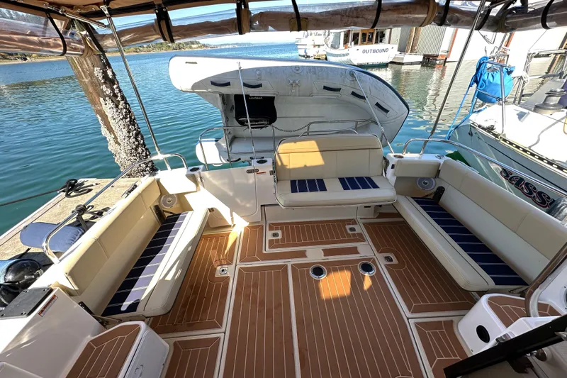 Two For The Road II Yacht Photos Pics 2020 Ranger Tugs R-29 boat interior with spacious seating and elegant wood flooring.