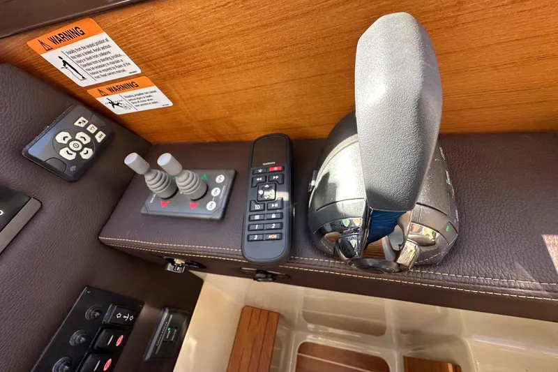 Two For The Road II Yacht Photos Pics Control panel of a 2020 Ranger Tugs R-29 boat with joystick and remote.
