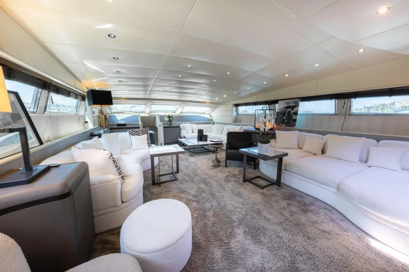 Lauren V Yacht Photos Pics Luxurious interior of 1997 Mangusta 103 yacht with elegant seating and modern decor.