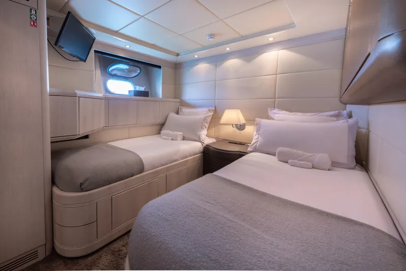 Lauren V Yacht Photos Pics Luxurious twin cabin interior of 1997 Mangusta 103 yacht with modern decor.