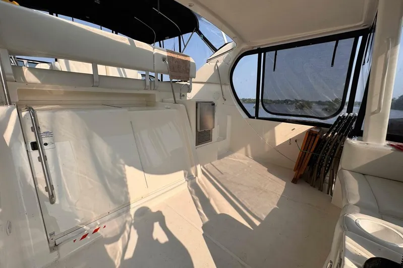  Yacht Photos Pics 2004 Silverton 35 Motor Yacht interior with seating and large windows.