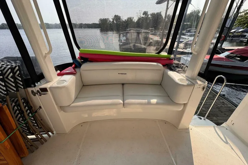  Yacht Photos Pics 2004 Silverton 35 Motor Yacht interior with white seating and lake view.