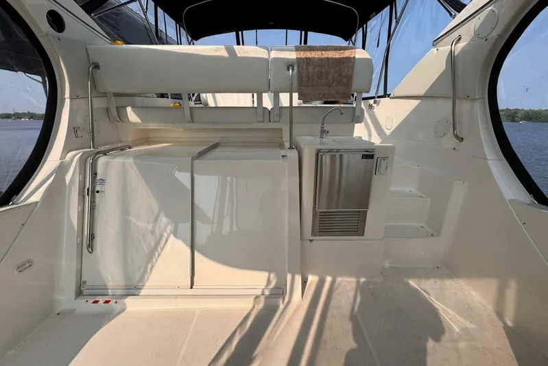  Yacht Photos Pics 2004 Silverton 35 Motor Yacht interior with kitchenette and seating area.