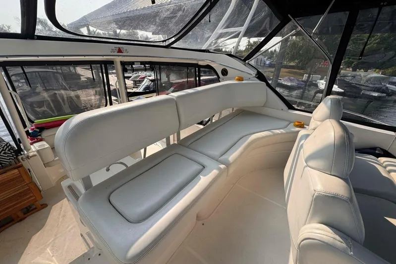  Yacht Photos Pics 2004 Silverton 35 Motor Yacht interior with white seating and panoramic windows.