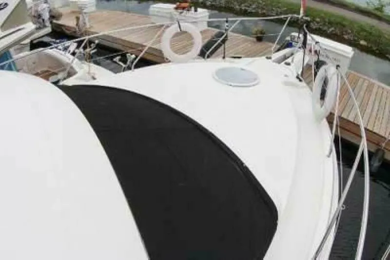  Yacht Photos Pics 2004 Silverton 35 Motor Yacht docked with life rings visible.