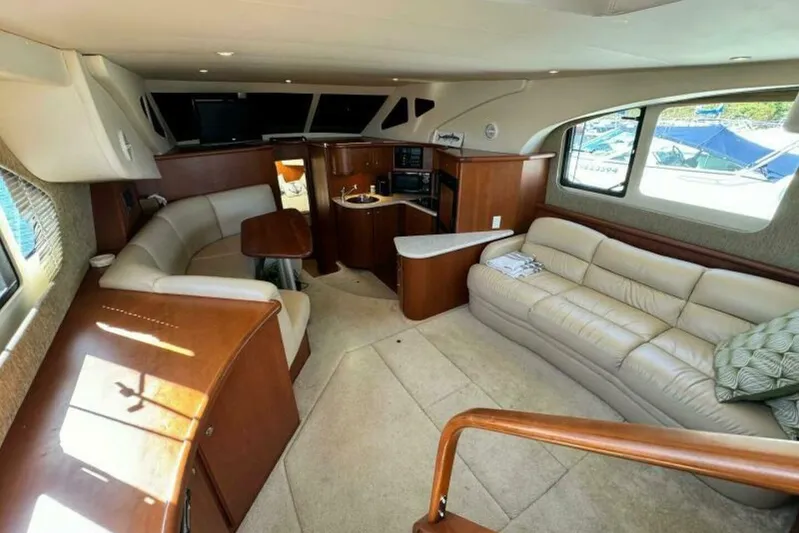  Yacht Photos Pics Luxurious interior of a 2004 Silverton 35 Motor Yacht with plush seating and elegant wood finishes.