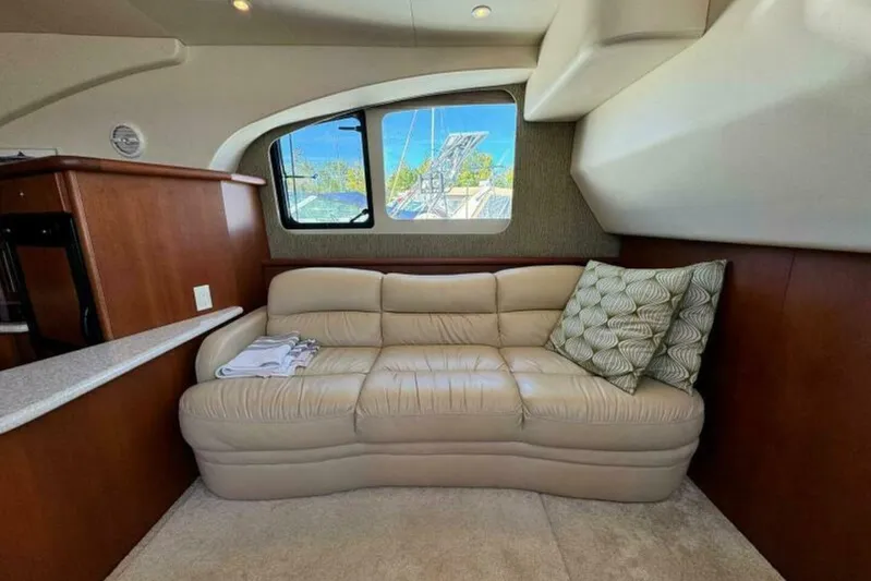  Yacht Photos Pics Luxurious interior of 2004 Silverton 35 Motor Yacht with beige leather sofa and cushions.