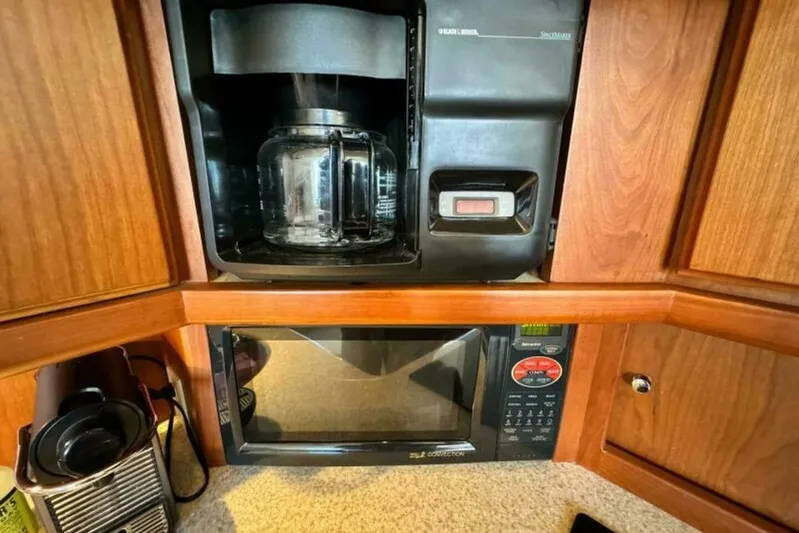  Yacht Photos Pics Coffee maker and microwave in 2004 Silverton 35 Motor Yacht kitchen.
