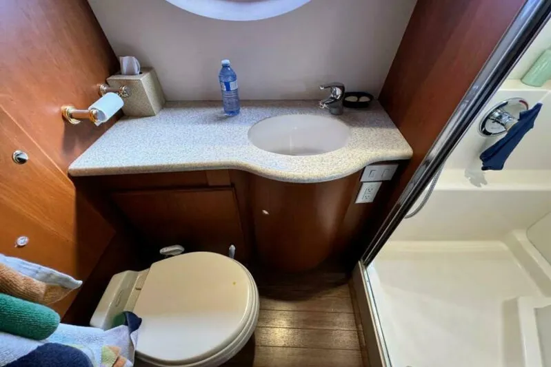  Yacht Photos Pics Bathroom interior of 2004 Silverton 35 Motor Yacht with sink, toilet, and shower.