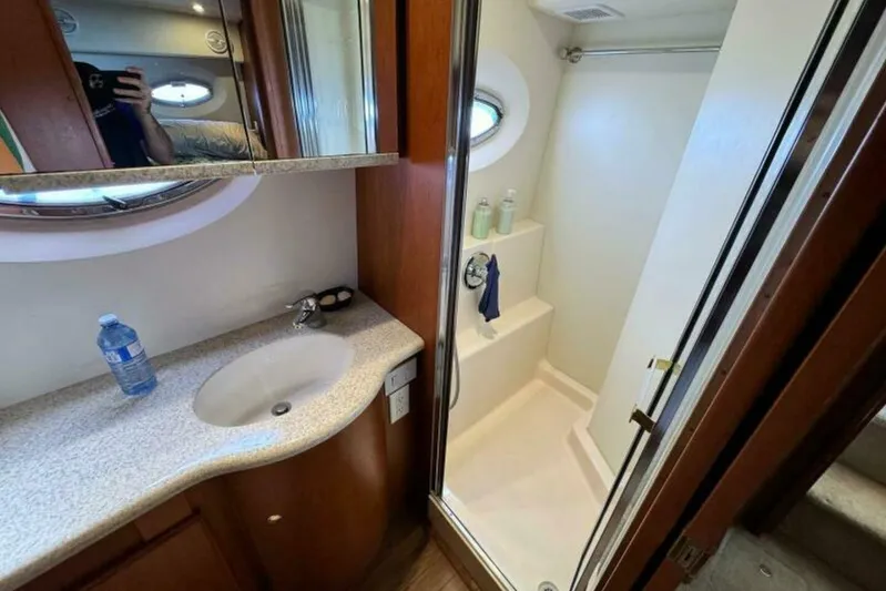  Yacht Photos Pics Bathroom interior of a 2004 Silverton 35 Motor Yacht with shower and sink.