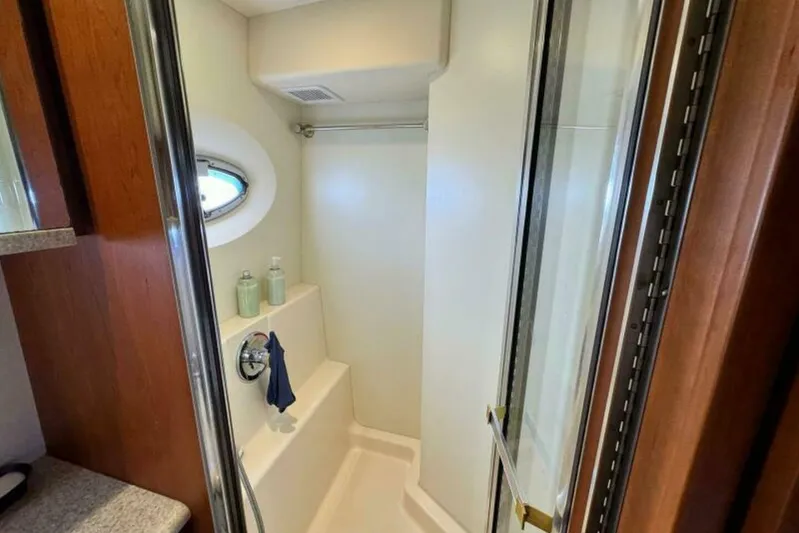 Yacht Photos Pics Shower area in 2004 Silverton 35 Motor Yacht with porthole and toiletries.