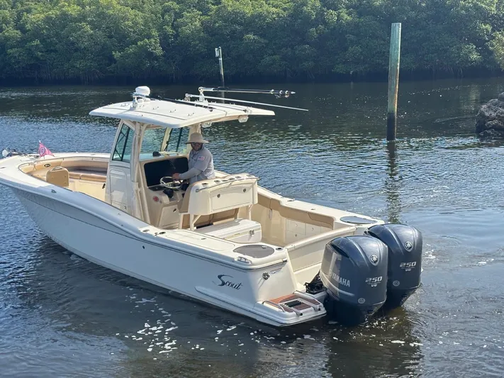  Yacht Photos Pics 2013 Scout 282 XSF boat with dual Yamaha engines on calm water.