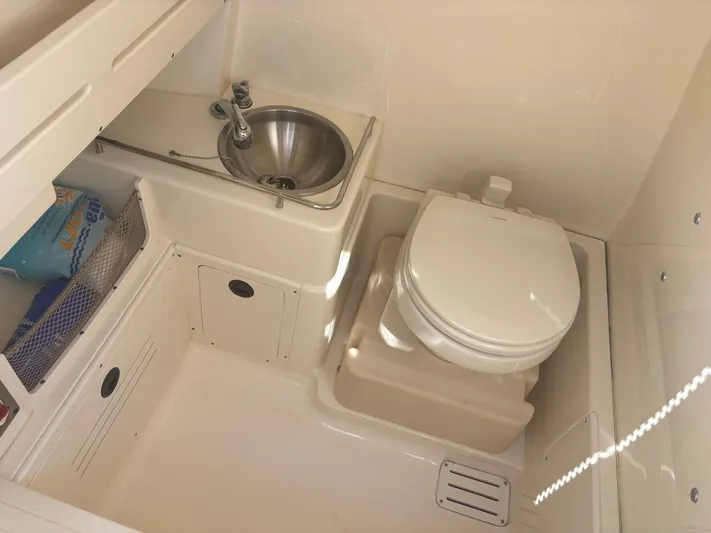  Yacht Photos Pics Interior of 2013 Scout 282 XSF with toilet and sink.