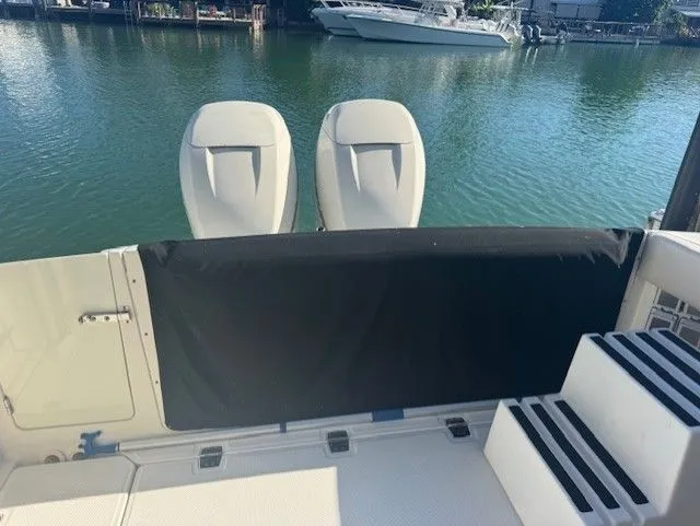  Yacht Photos Pics 2016 Boston Whaler 320 Vantage by the water with twin engines.