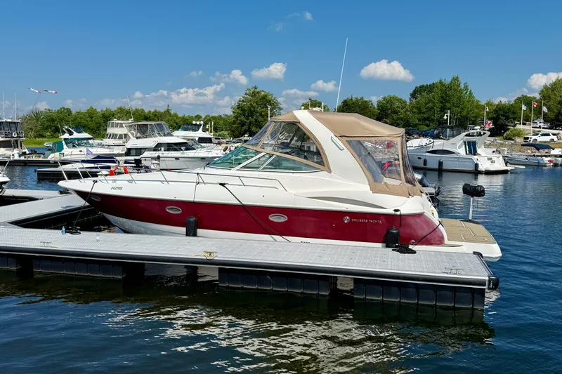  Yacht Photos Pics 2004 Cruisers Yachts 3672 docked at marina under clear blue sky.