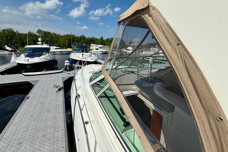  Yacht Photos Pics 2004 Cruisers Yachts 3672 docked at marina under clear blue sky.