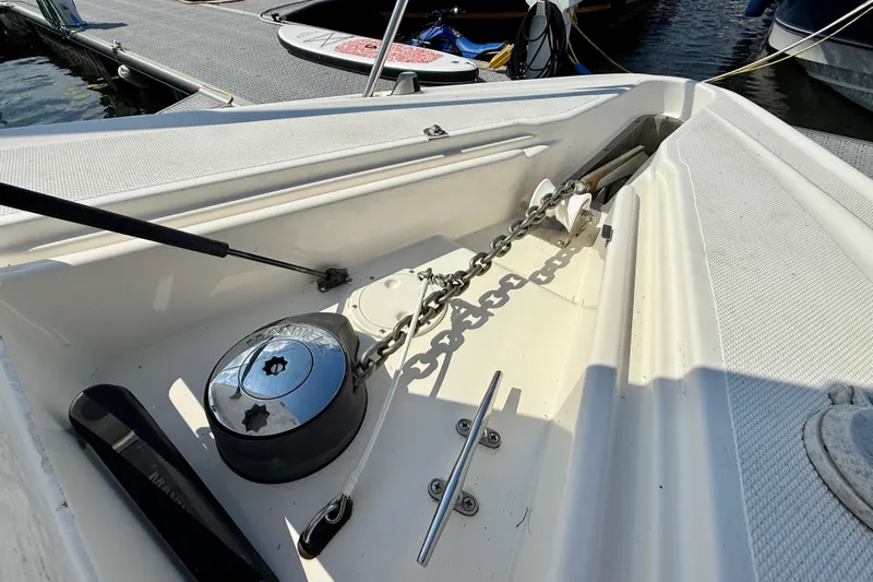  Yacht Photos Pics 2004 Cruisers Yachts 3672 anchor chain and windlass on deck at marina.
