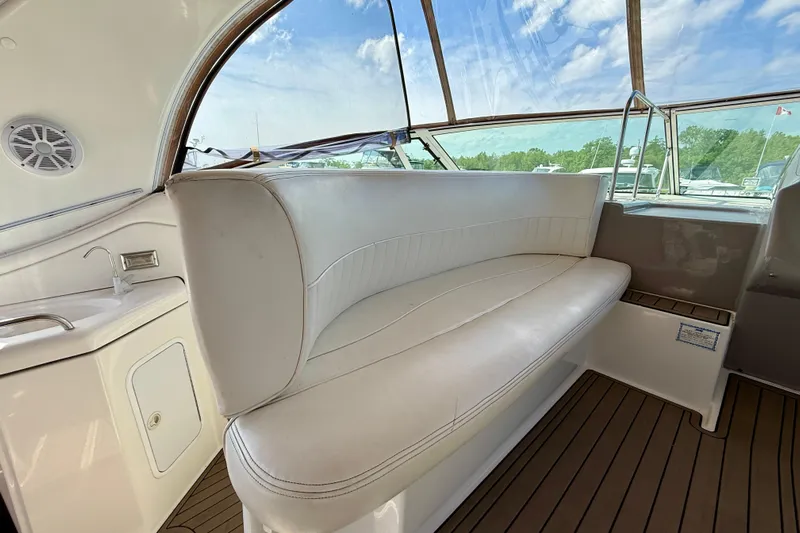  Yacht Photos Pics 2004 Cruisers Yachts 3672 interior with white seating and wooden flooring.