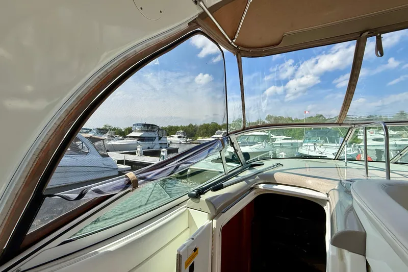  Yacht Photos Pics 2004 Cruisers Yachts 3672 interior view with marina and boats in background.