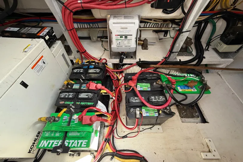  Yacht Photos Pics Electrical system of a 2004 Cruisers Yachts 3672, featuring multiple batteries and wiring.