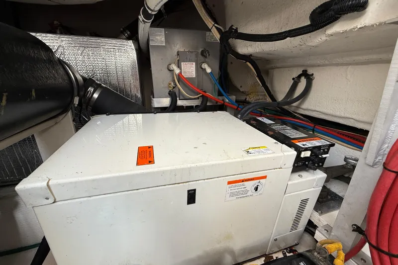  Yacht Photos Pics Engine room of 2004 Cruisers Yachts 3672 with generator and wiring.
