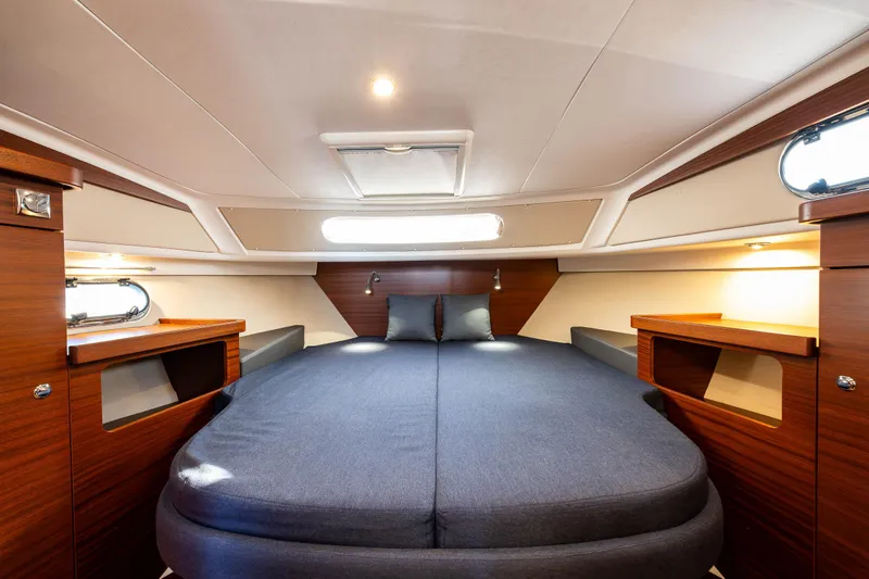 Keokuk Yacht Photos Pics Luxurious interior cabin of 2020 Nimbus 365 Coupe yacht with cozy bedding.