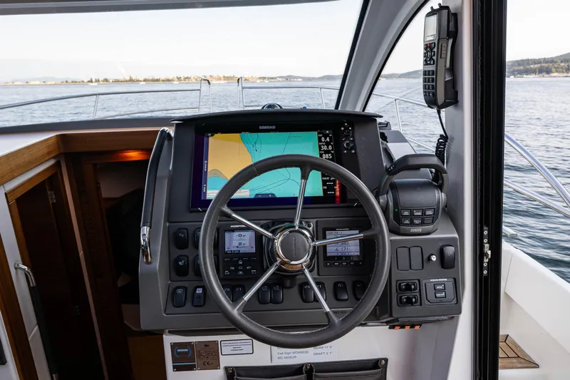 Keokuk Yacht Photos Pics Nimbus 365 Coupe 2020 helm with navigation system and steering wheel on open water.