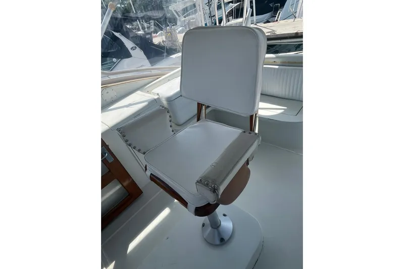  Yacht Photos Pics White captain's chair on 1993 Buddy Davis 38 Express boat, featuring sleek design and sturdy construction.