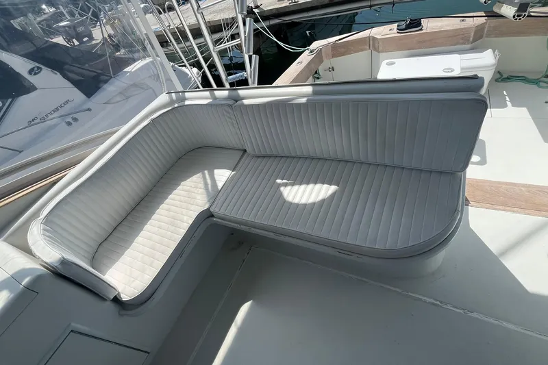  Yacht Photos Pics 1993 Buddy Davis 38 Express boat with white cushioned seating in the cockpit area.