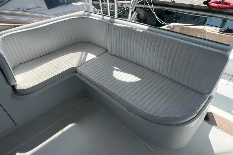  Yacht Photos Pics 1993 Buddy Davis 38 Express boat with white cushioned seating in the cockpit area.