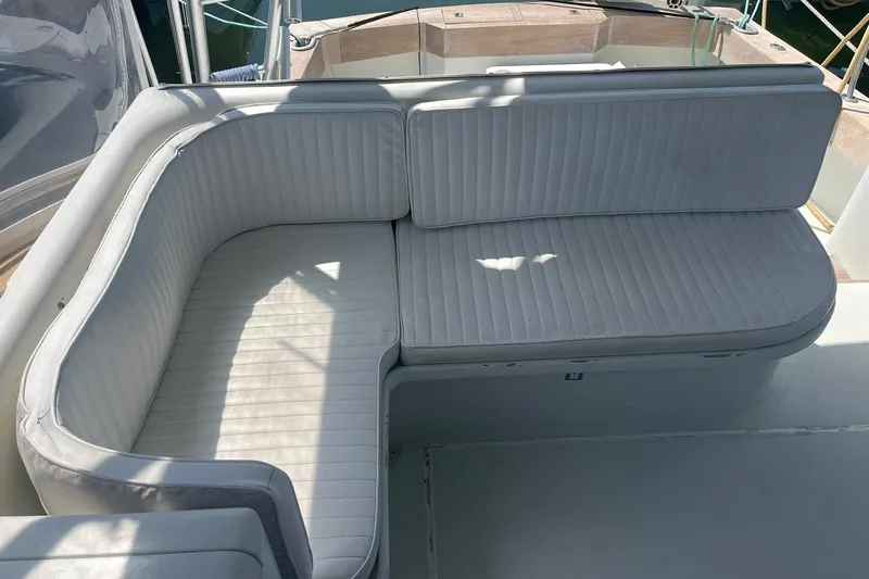  Yacht Photos Pics White cushioned seating on 1993 Buddy Davis 38 Express boat deck.